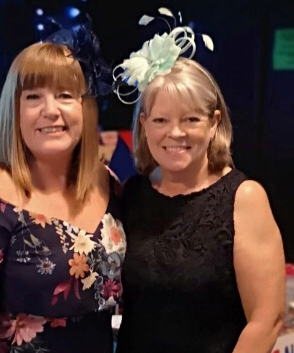 College Charity Race Night Event Organisers Joanne and Julie standing next to each other at the MIND event