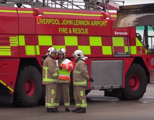 Fire Engine and Firefighters at Liverpool John Lennon Airport for Wirral Met College Travel and Tourism Live Emergency Exercise