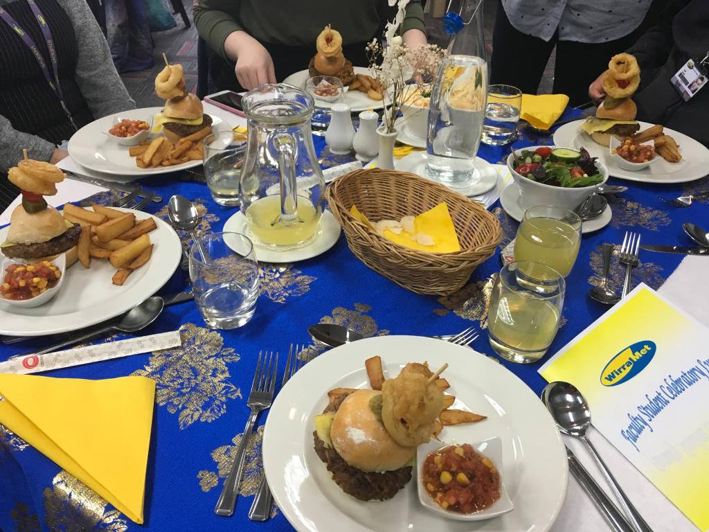 Wirral Met Student Celebratory Lunch 2017 table with Burgers and Chili Chips