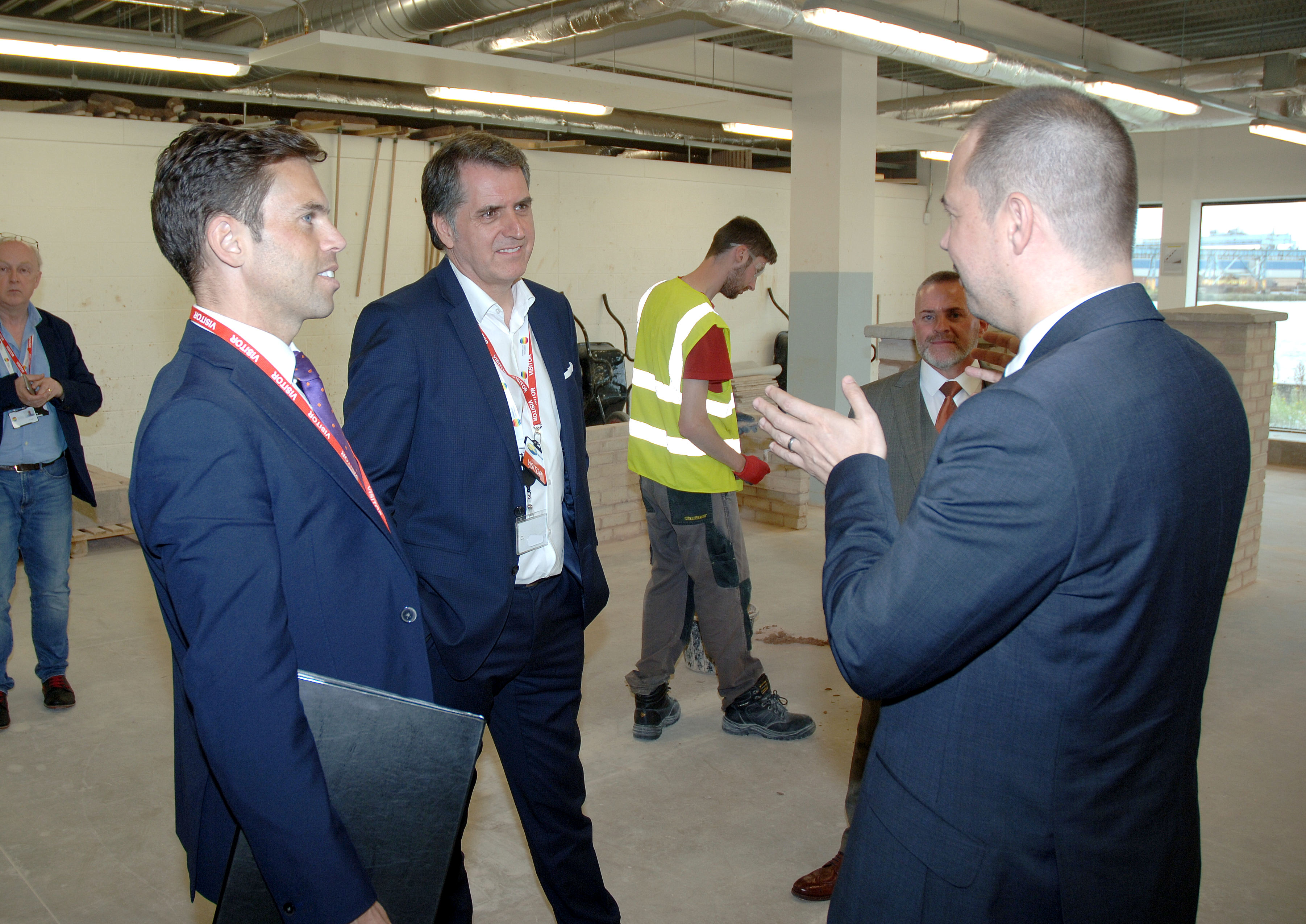 Metro Mayor Steve Rotheram and Ken Skates speaking to Michael Norton at the Wirral Waters campus