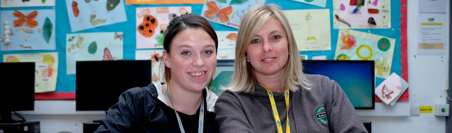 Two Wirral Met Understanding Children and Young People's Mental Health students sitting in classroom