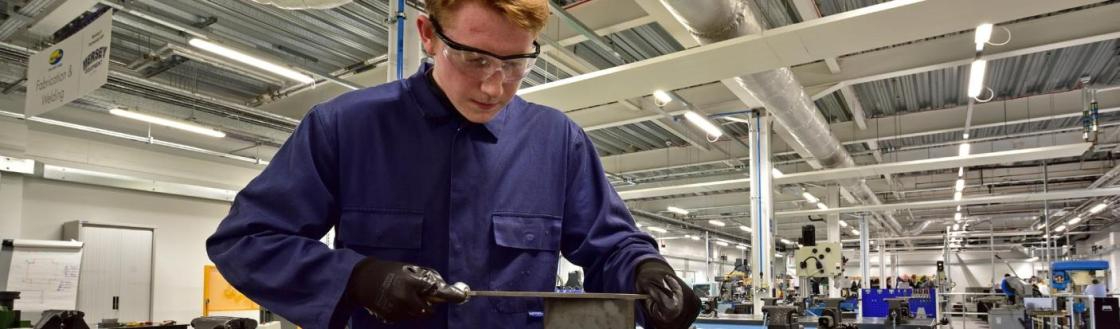 WMC Advanced Manufacturing Engineering student working inside classroom