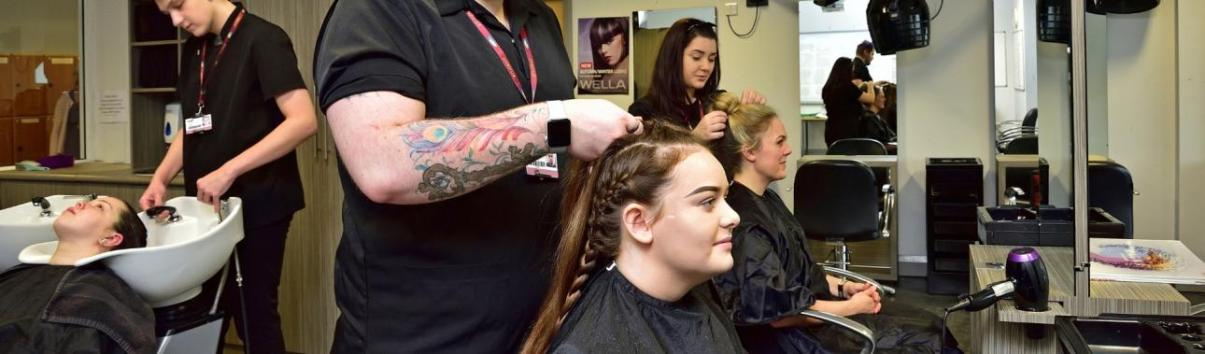 WMC Women's Hairdressing Level 3 students working inside classroom