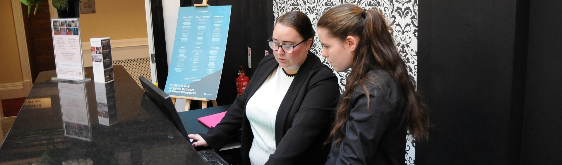 Two WMC Trainees working inside hotel