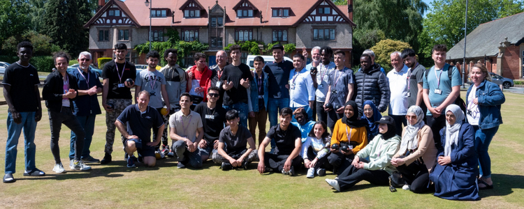 ESOL students in a group picture on Port Sunlight bowls field