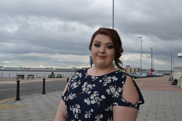 Former Wirral Met Health and Social Care student Alisha Nelson standing near the Floral Pavillion