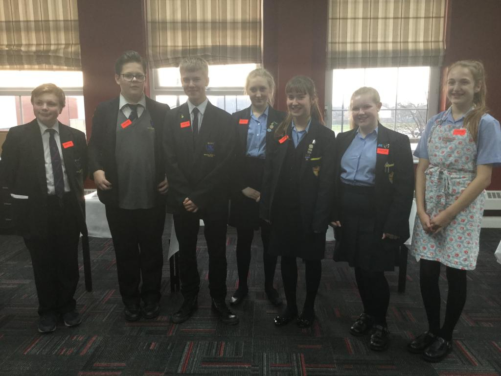 Bake Off 2017 students lined up together wearing uniforms at the Wirral Met Conway Park campus