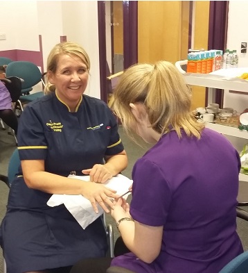 Wirral Met Beauty Therapy student pampering Clare Pratt, Deputy Director of Nursing for Stress Management Pamper Day