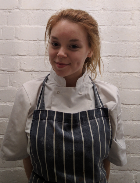 Wirral Met Hospitality and Catering student Emily Milne wearing a cooking apron for the first round of the Wirral Young Chef Competition at Leasowe Castle