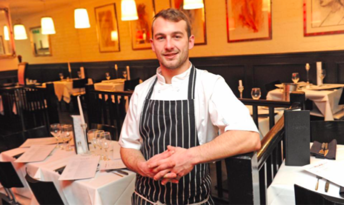 Wirral Met's Former Wirral Young Chef finalist Robert Manger standing inside of Milan (The Restaurant) in West Kirby 