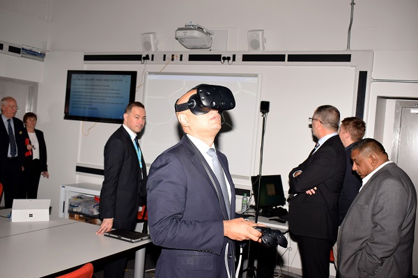 Savid Javid, Secretary of State for Communities and Local Government, trying out the virtual reality headset at the Wirral Met Twelve Quays STEM Centre