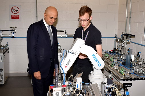 Sajid Javid, Secretary of State for Communities and Local Government, speaking to a Wirral Met STEM student at the Twelve Quays STEM Centre