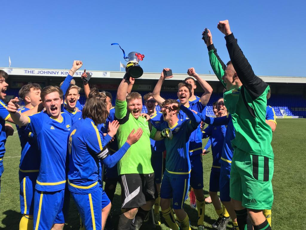 Wirral Met Football Team celebrating winning the Cup Final 2017