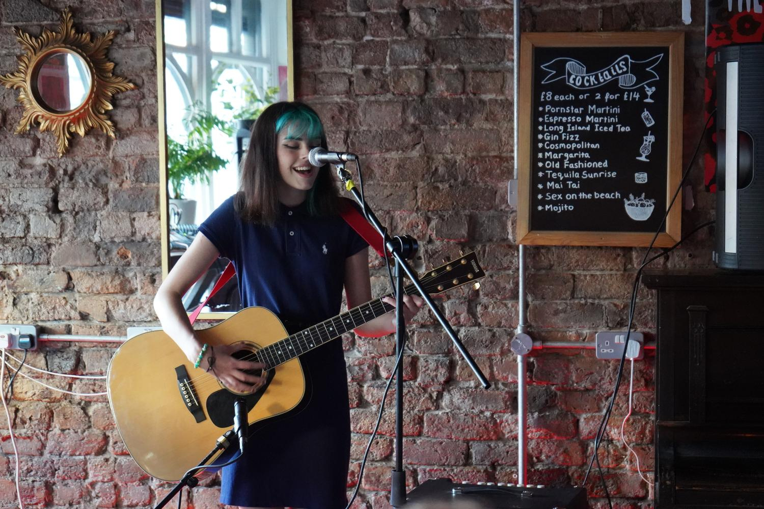 Female music student performing at Rockpoint Records