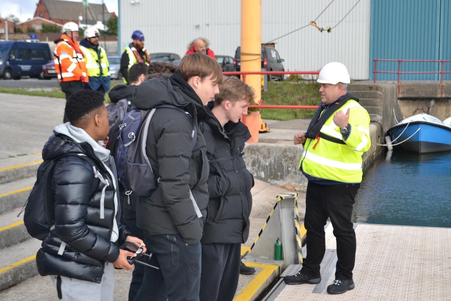 Students being instructed on how to use the WasteShark.