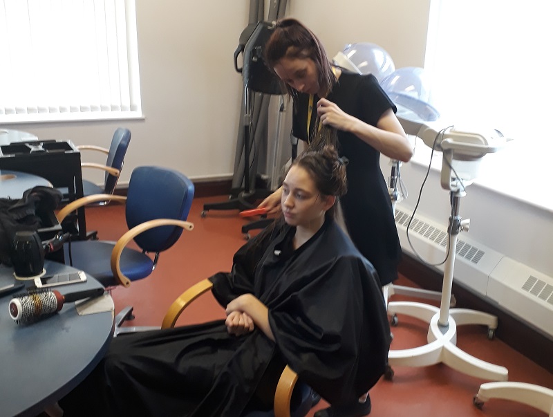 Wirral Met Hair and Beauty student working on another Female student