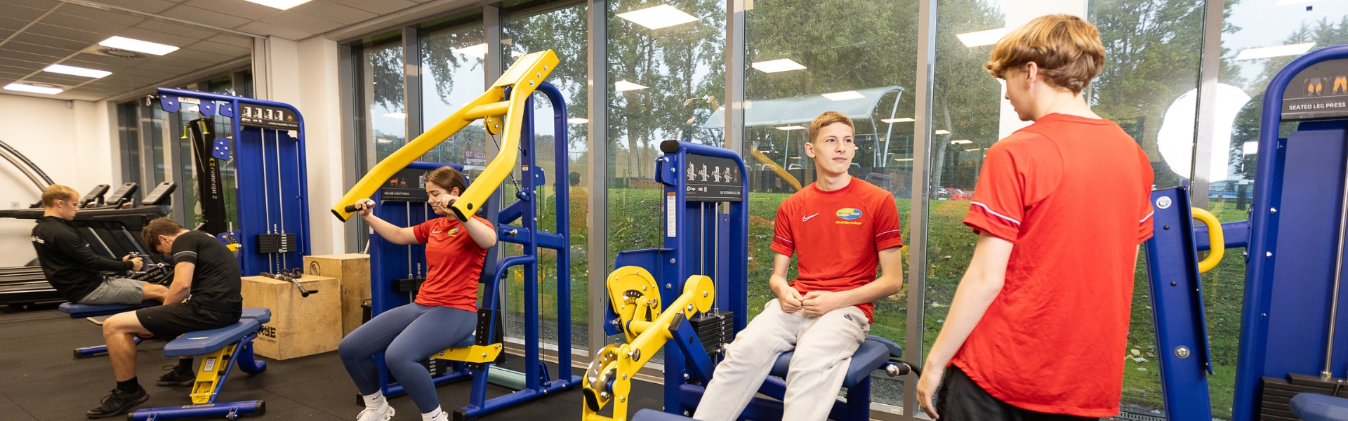 Fitness students working at the gym inside Oval campus