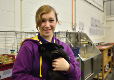Wirral Met Animal Management student holding a rabbit