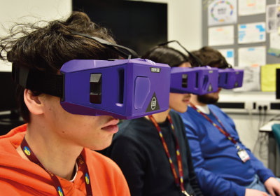 Three Full Time Computing And IT Students Wearing Virtual Reality Headsets