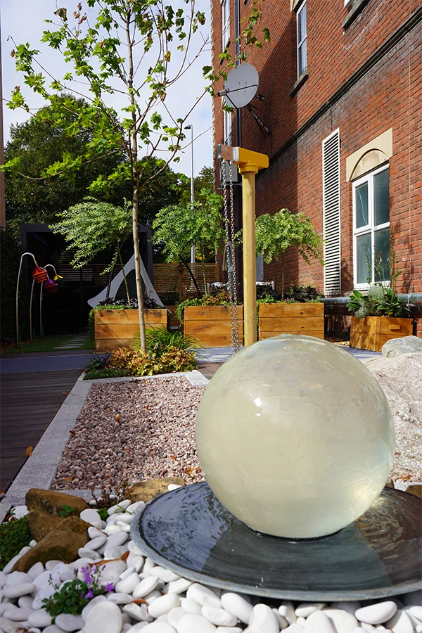 A tranquil Space with a water fountain in the centre