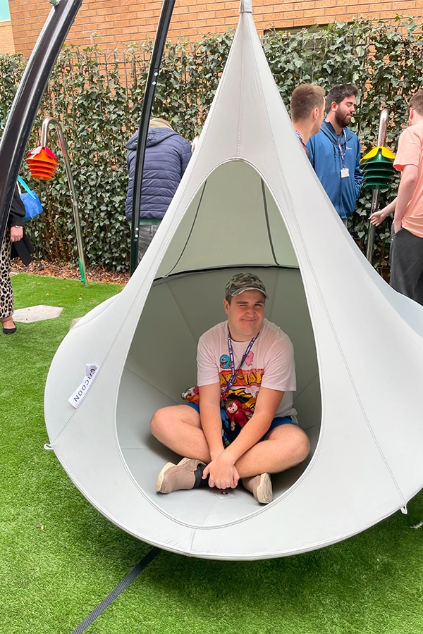a Student sat in a swinging chair