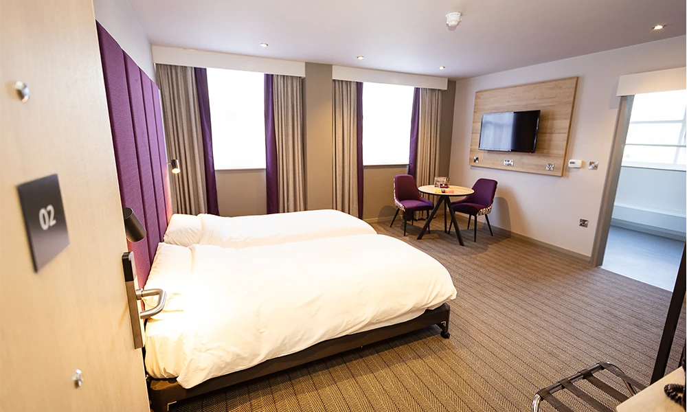 Premier Inn Hotel room, with twin beds and amenities.