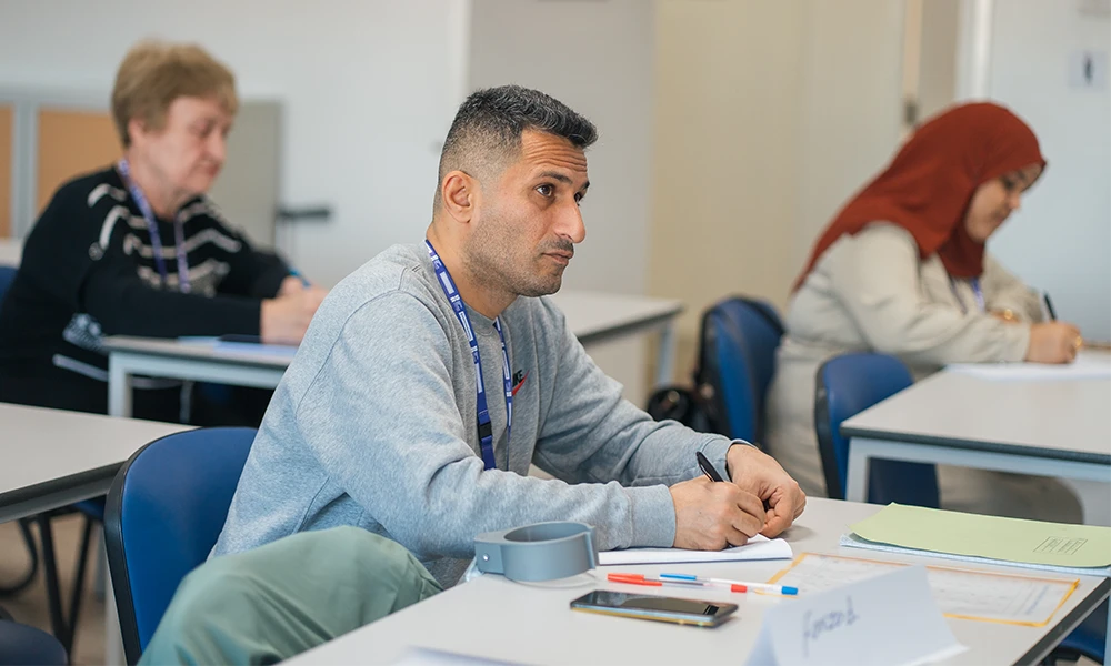 Business Students sitting inside classroom learning