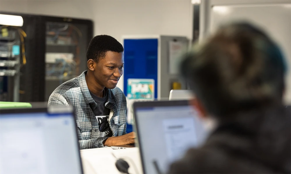 Computing students working inside Twelve Quays classroom
