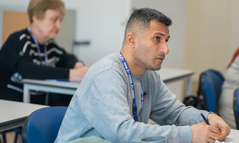 ESOL student standing inside Conway Park campus