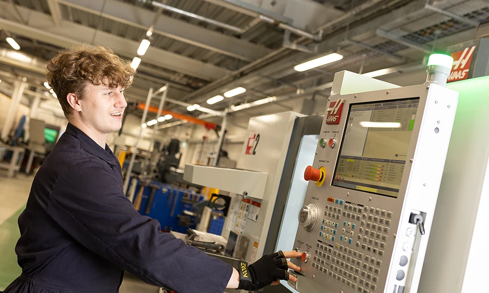 Engineering students working inside workshop at Twelve Quays
