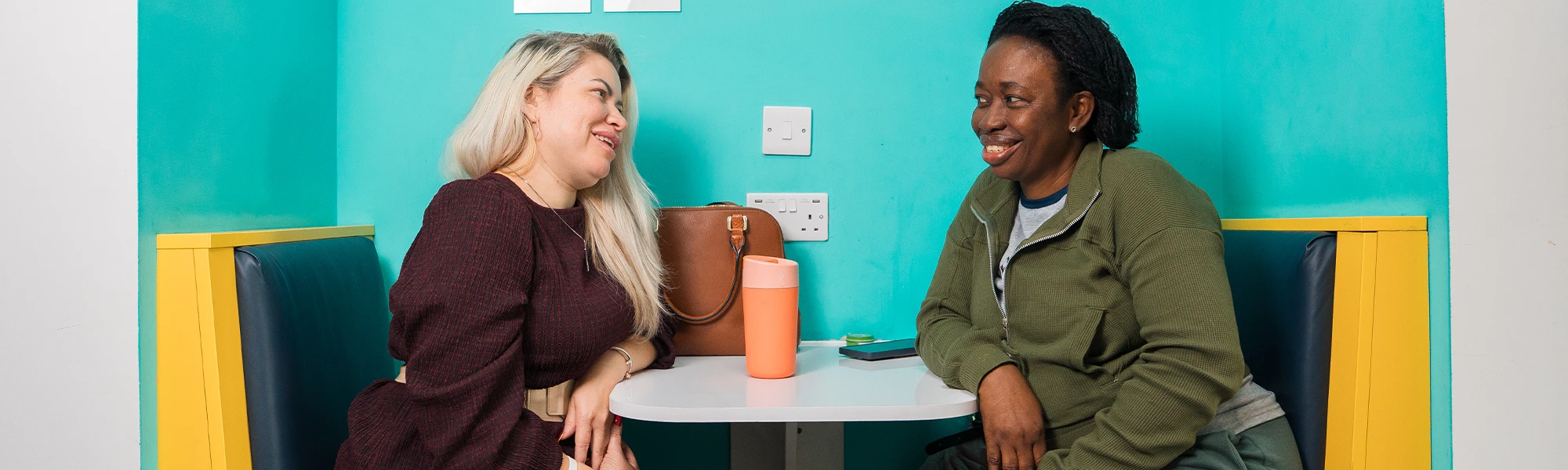 Two women sat at a table
