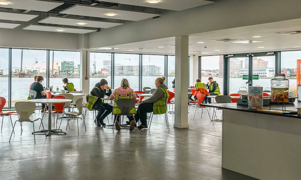 Students at the Wirral Waters campus sitting down inside the canteen