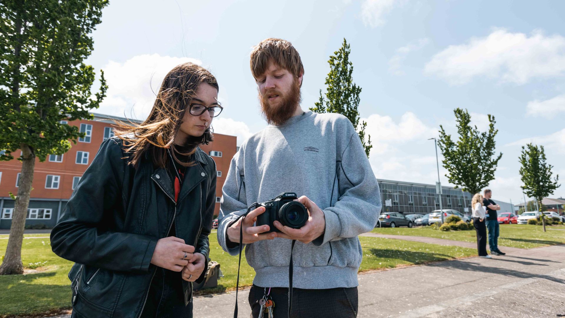 Student with Photography lecturer in Twelve Quays grounds