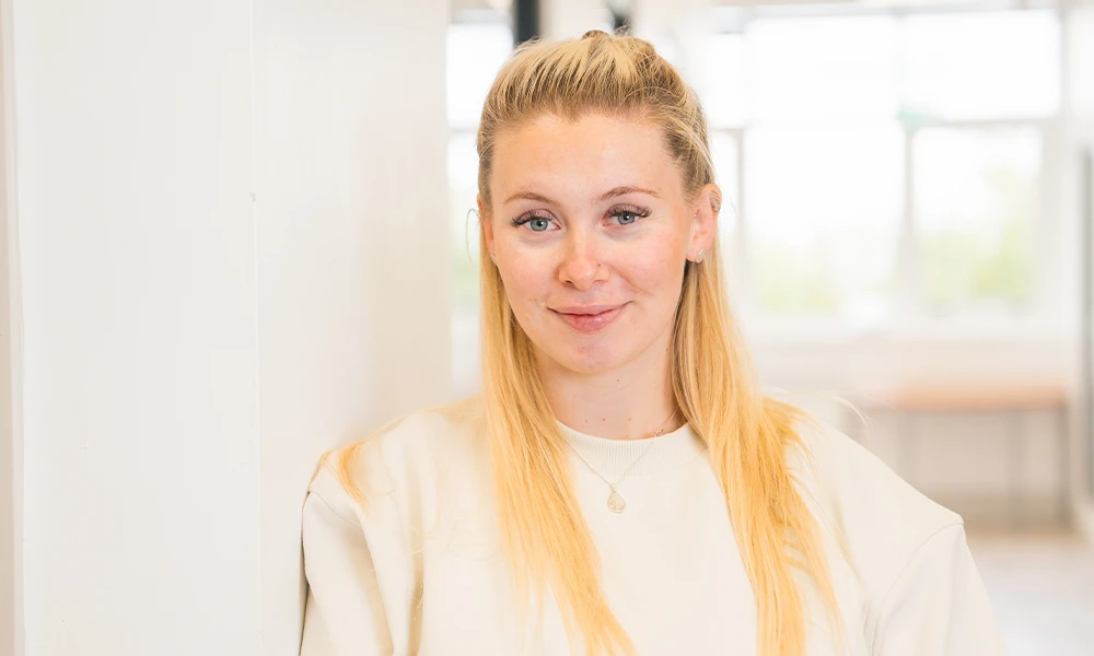 Blonde Female Smiling directly into a camera