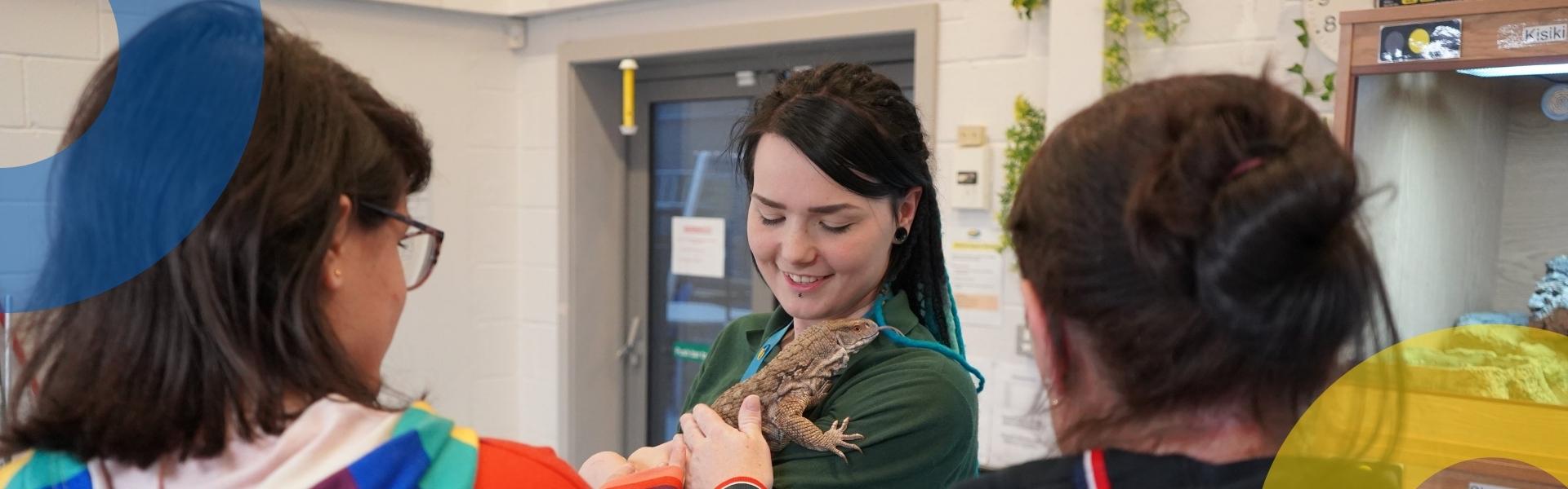wirral met college students in animal management suite holding lizard