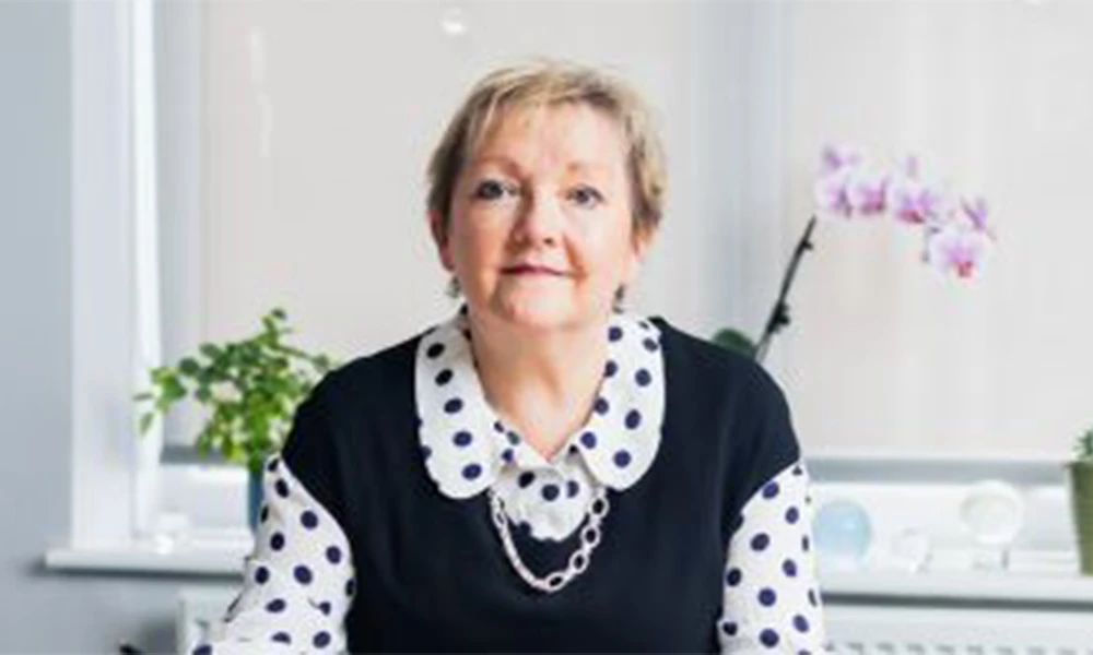 Principal Sue Higginson sitting inside office