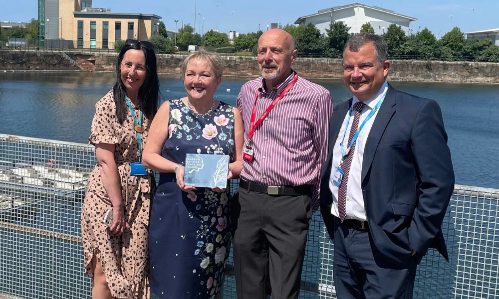 Wirral Met SLT standing with Principal at Twelve Quays campus