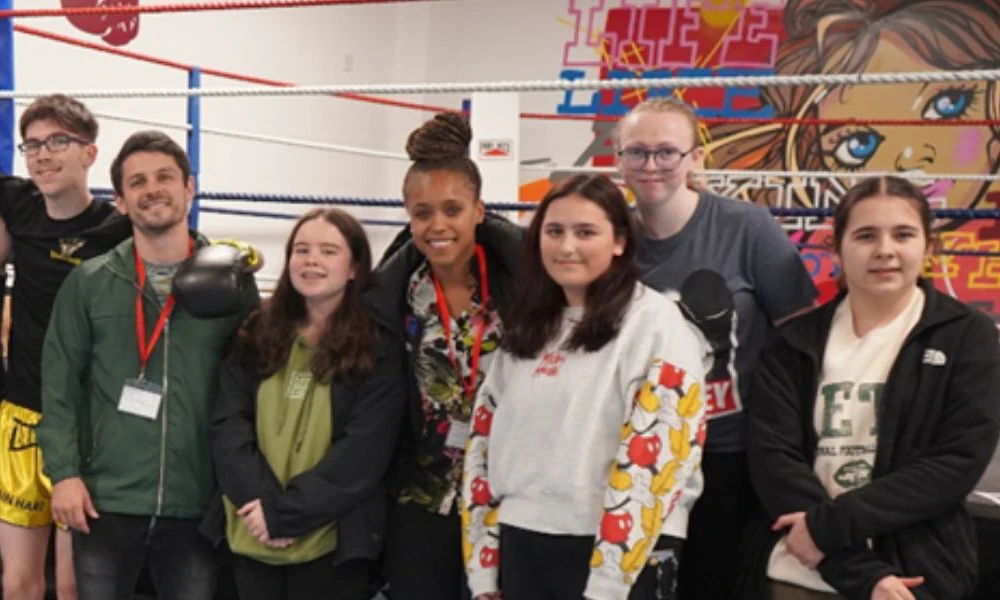 Natasha Jonas standing with Wirral Met students at The Hive