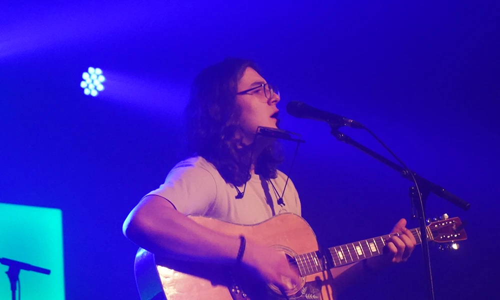 Wirral Met music student Isaac playing guitar at Future Yard