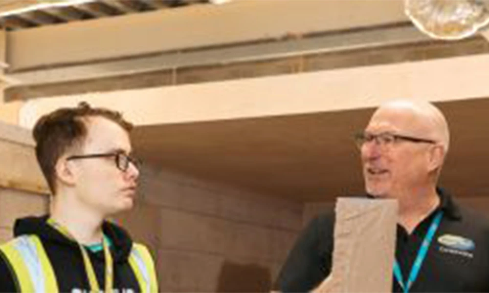 Wirral Met tutor teaching construction in workshop