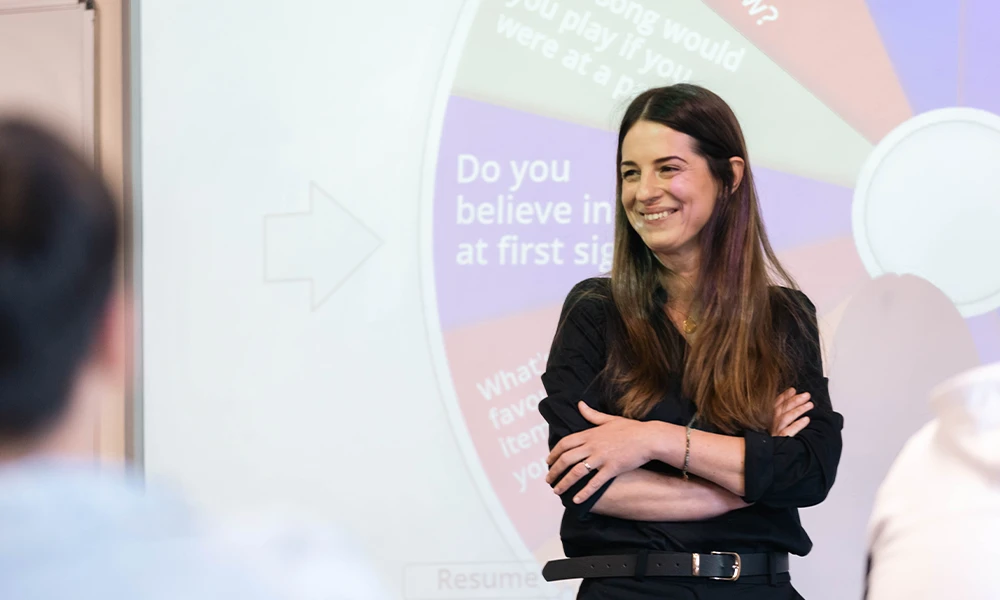 Wirral Met tutor standing in front of classroom