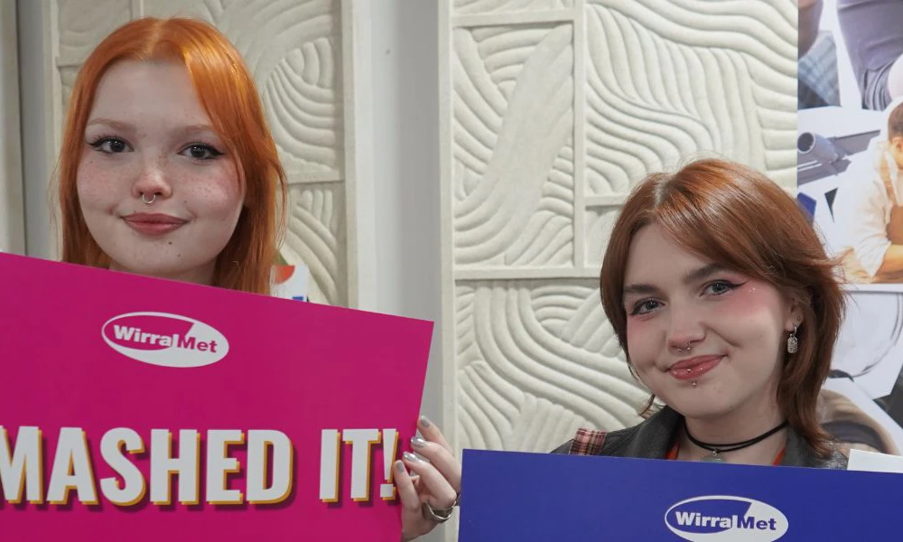 Wirral Met students celebrating passing their course