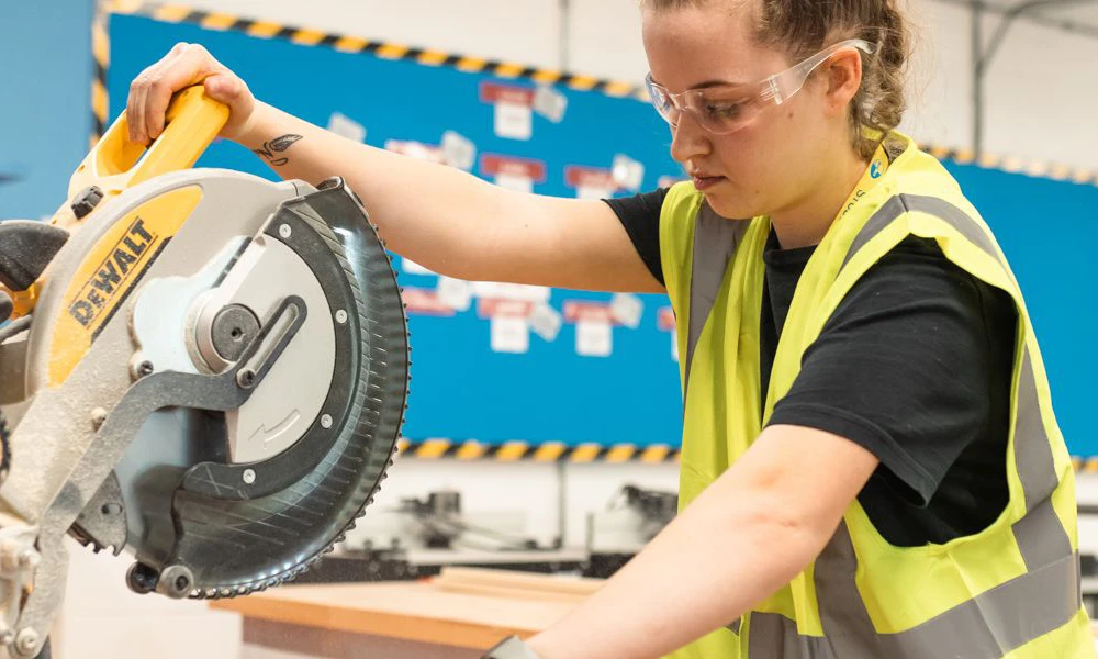 Carpentry student using machinery at Wirral Waters campus