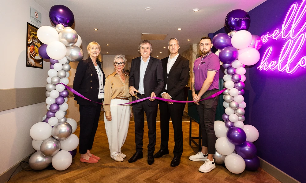 Principal Gill Banks standing with Metro Mayor Steve Rotherham and Premier Inn Managing Director Simon Ewins during ribbon cutting ceremony for Premier Inn facility at Wirral Met