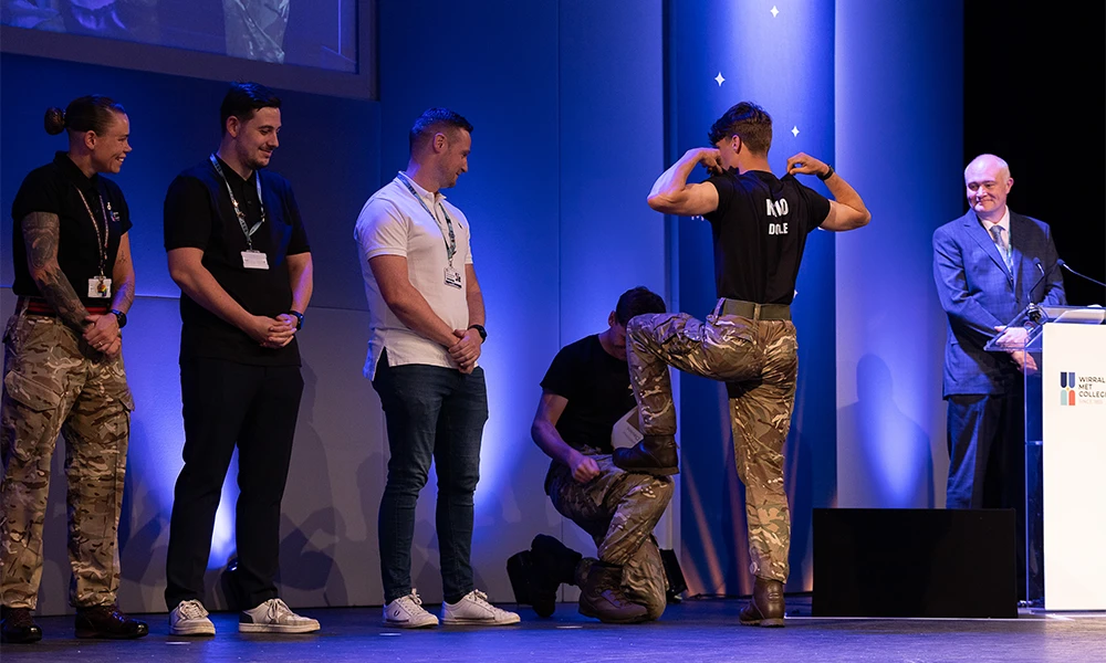 A group of Military Preparation students on stage posing towards the audience