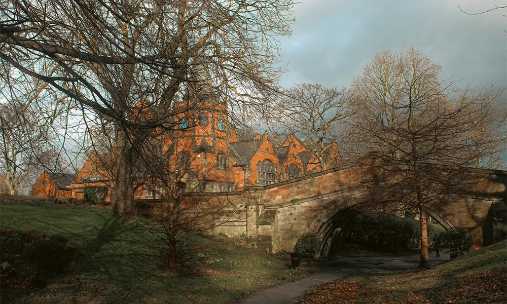 An orange building with trees infront