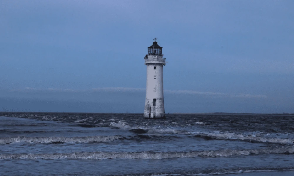 A beach with a lighthouse