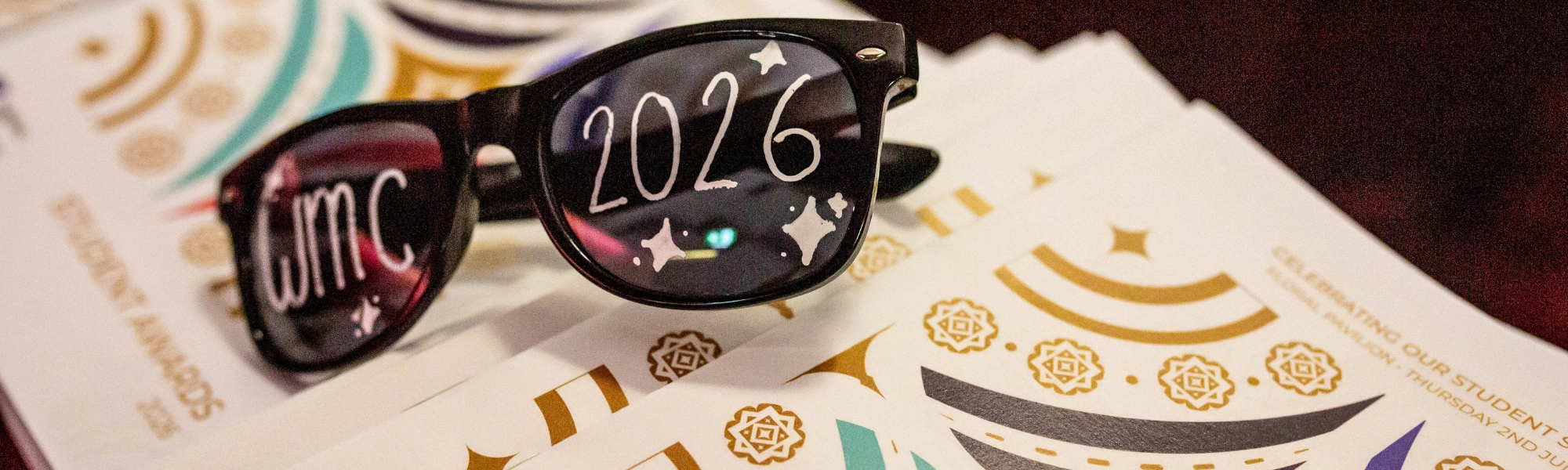 Glasses with WMC 2026 Written on them